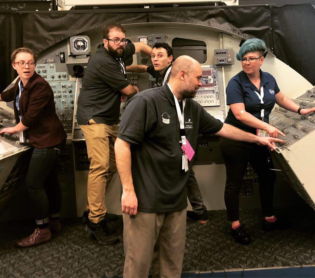 The 2018/2019 Boise State University NASA SUITS Team goofs off outside Mission Control, at NASA's Johnson Space Center.